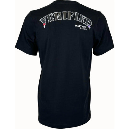 Christian clothing brand showing the back of a black unisex faith-based shirt. The word verified is written on back in white letters with two small pink and purple splats on each side. Faith inspired design using scripture from Matthew 7:21-23 which is written below the word verified.